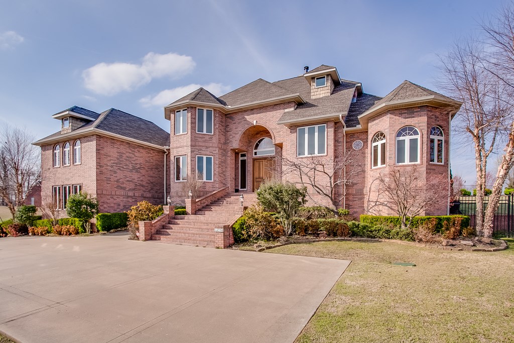 Exquisite custom home sits on 2 acres in gated Beaver Lake upscale neighborhood. Boat slip included! Many custom features including 8ft doors (9ft french door leading to veranda), high ceilings, custom arches, extra tall (and plentiful!) windows, & much more! (Amenities list available)   Inviting master suite w/over-sized double shower, whirlpool tub, his & her vanities/closets. Large game room w/wet bar. 1000 SF of mostly covered outdoor living space! Extensively wired for sound & media. Close to town!