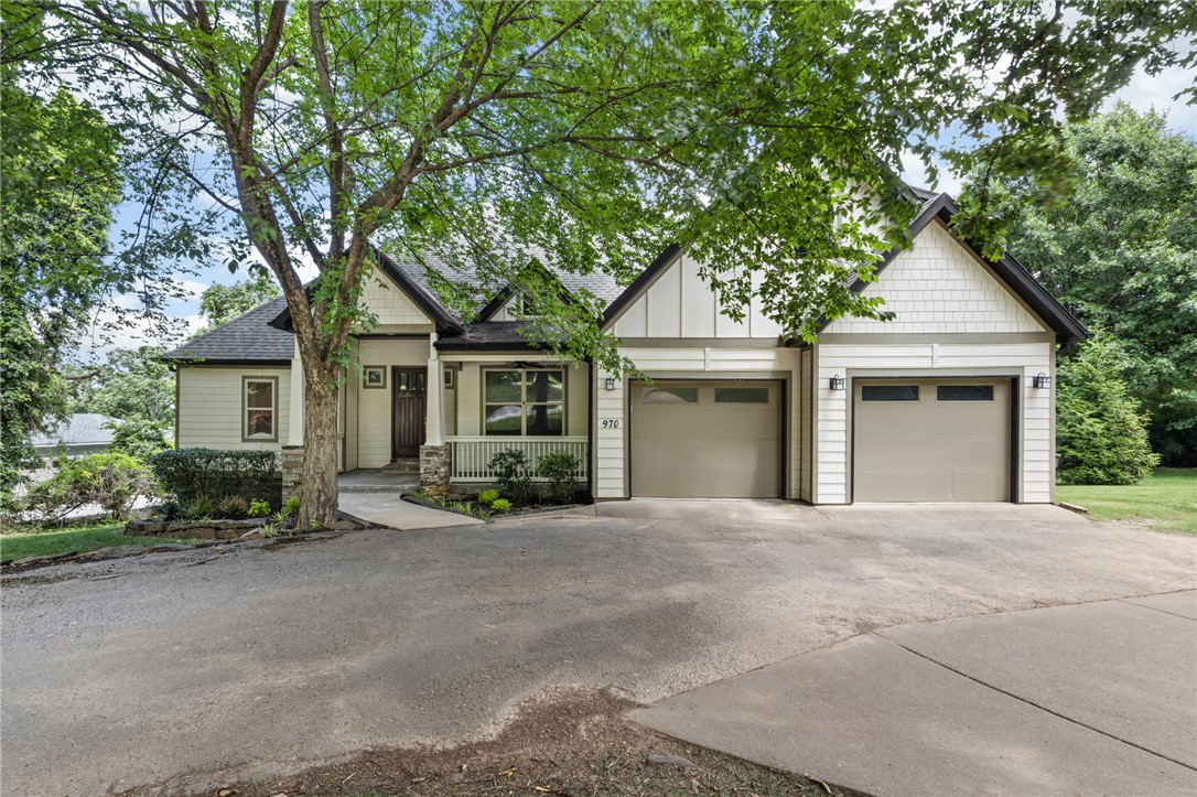 Tucked into a quiet, tree-lined pocket just a short walk from Root Elementary, 970 N Eastwood Drive offers privacy, space, and easy everyday living on an oversized lot. Within approximately 3,224 square feet, the main level includes a generous primary suite with large bath and a separate guest suite with its own full bath. The eat-in kitchen is the natural gathering spot with a large island, 5-burner gas cooktop, double ovens, and open sightlines to the breakfast nook and main living area with gas-log fireplace. Wired sound extends through the living room, primary bath, and outdoor spaces. Upstairs are two additional bedrooms, a full bathroom, and a spacious bonus room ideal for media, office, or play. Outside, a private deck with hot tub overlooks a deep backyard framed by mature trees and Thuja Green Giants. Whole-yard irrigation, lush fescue, and a WiFi-enabled Rachio system keep the landscape low-maintenance and polished. Visit our open house this weekend and see for yourself!