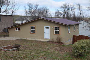 Fresh and updated!  Great starter home with basement! Living room, family room, and bonus basement space. New windows, new flooring, stained deck and privacy fence. New metal roof added in December 2015.