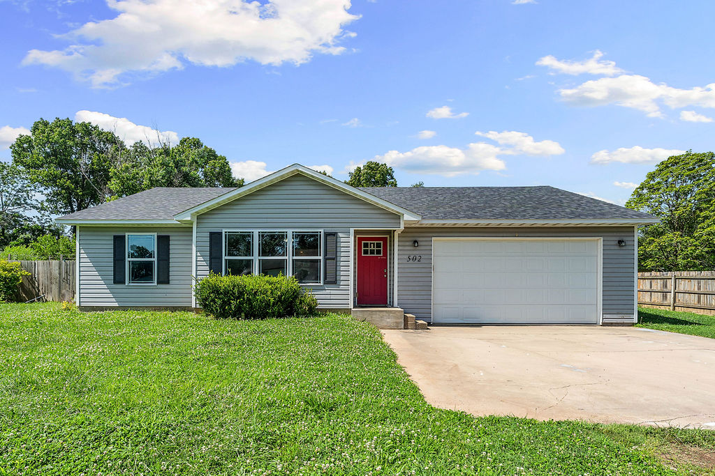 Affordable home sitting on almost a half acre in the great city of Pea Ridge. When you swing open the front door you will be greeted by the open floor with wood look tile throughout home, no carpet in this home. The large living room has plenty of room for the entire family to sprawl and opens to the huge kitchen with all stainless appliances, tons of counter space, more cabinets than you can fill up and a place for family dinners in dining area. This split plan features a large primary bedroom with ensuite with walk-in-closet. The other side of the home features two more bedrooms, bathroom and the utility room allowing privacy for Mom and Dad and space for the kids. Out back the kids and pets can play in the huge, fenced, flat backyard. This yard is big enough for all the games the kids can think of and plenty of room for the pets to roam. This home would also make a great rental for someone looking to add to their portfolio. Seller offering $5000 in closing costs paid with approved offer.