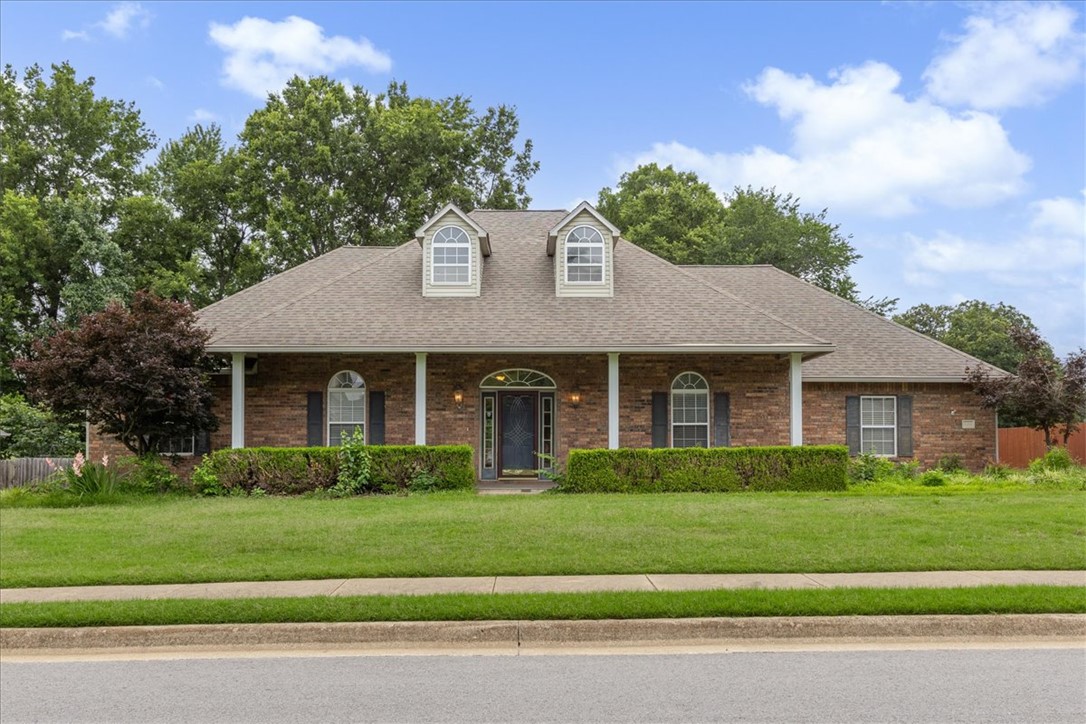 Location, Location, Location! This beautifully maintained 4-bedroom, 2.5-bath home offers 2,573 sq. ft. of living space on a beautifully landscaped lot in the desirable Monticello subdivision, conveniently located near I-49, restaurants, shopping, schools & everything Northwest Arkansas has to offer. The split floor plan features a spacious family room with crown molding, hardwood floors, a cozy gas fireplace & incredible built-ins offering abundant storage. A formal dining room & an eat-in kitchen provide plenty of space for everyday living & entertaining. The spacious primary suite includes a well-appointed bath with dual vanity, & a tiled walk-in shower. Enjoy relaxing on the large covered front porch or the covered back porch overlooking the level, landscaped backyard & peaceful private pasture beyond. An irrigation system services both the front & back yards. Combining space, comfort, functionality & timeless appeal, this exceptionally well-maintained home is ready for its next owner to enjoy.