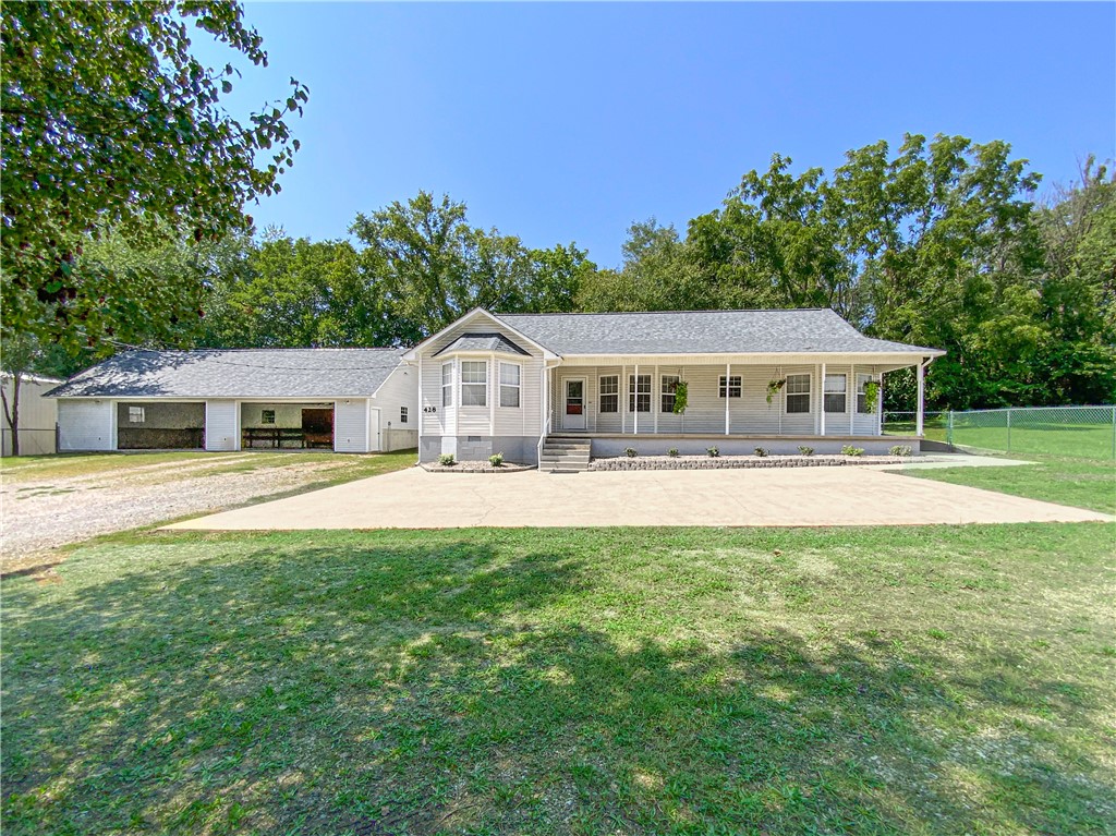 Home on 2.41 acres in city limits of Yellville.  This 3-bedroom 2-bathroom homes sits on the edge of town with a fully fenced yard with chain link fencing and gates. There is a 4th room that would make a great office or use for a 4th bedroom. The master suite has a jacuzzi tub and shower. The tree lined drive takes you to a concrete parking pad in front of the home and a detached 26x51 two car garage with workshop area or could be used as 4 car garage. There is also separate storage for an RV or other toys. Home has new roof and is move in ready.