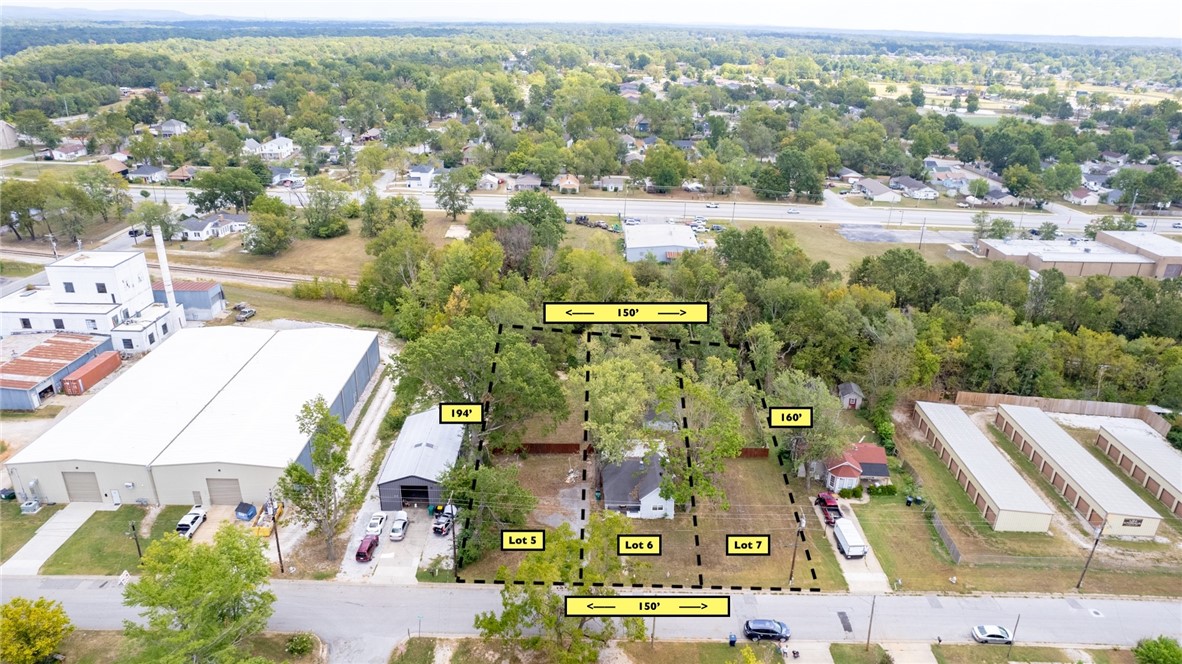 RARE ZONING - 3 Lots, Totaling .60acres, zoned as Industrial Arts or Town Center Low under the new unified code. This site has endless possibilities. Surveys, rezone and lot split details are complete and available. Each lot is 50' wide and varies in depth from 164' to the largest at 194'. Per the new code, up to 90% lot coverage and 6-story building height is allowable. . Read the full code here https://codehub.gridics.com/us/ar/rogers-udo. There is a structure on the middle lot, but property being sold as-is for land value only.