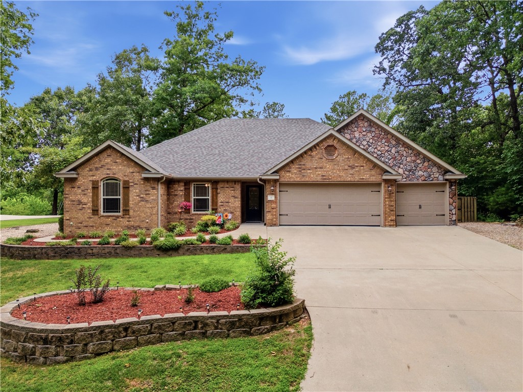 A little slice of paradise! Enjoy mature tress all around, a quiet cul-de-sac location, and all living space in this home is on one level. Located only 5 minutes to the newly built bike-lift, and the Bella Vista biking-trails are within walking distance! This house has beautiful hardwood floors, granite countertops, commercial size refrigerator and lots of custom cabinets. HVAC is only 4 years old and new roof & gutters were installed last year! There is a 3 seasons sunroom on back of home that looks out to a fully fenced-in backyard. The 3-car garage is spacious and great for multiple vehicles and/or extra storage. With so many great features you won't want to leave home. Hurry, before this one is gone!