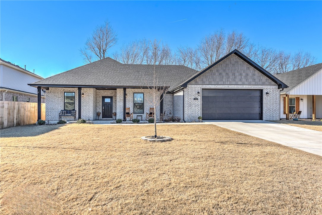 Single-story farmhouse style with unique character & a welcoming front porch that sets the tone from the start. Inside offers an open, easy-flow layout with a large living area & a well-designed kitchen featuring a large island with seating, abundant cabinetry, walk-in pantry, granite countertops & stainless steel appliances. The primary suite provides a comfortable retreat with a soaking tub, walk-in shower & dedicated makeup vanity. Additional highlights include a formal dining room & a functional utility room with sink. Step outside to a generous covered patio overlooking a private, fenced backyard, all in a convenient central location close to schools, shopping & everyday amenities.