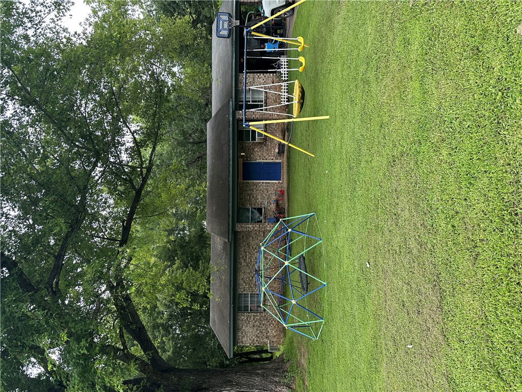 3 Bedroom, 1.5 bath brick home situated on approximately 1 acre. nestled beneath large, mature shade trees. The spacious yard provides ample space for gardening, entertaining or simply relaxing in the shade. A great investment opportunity,