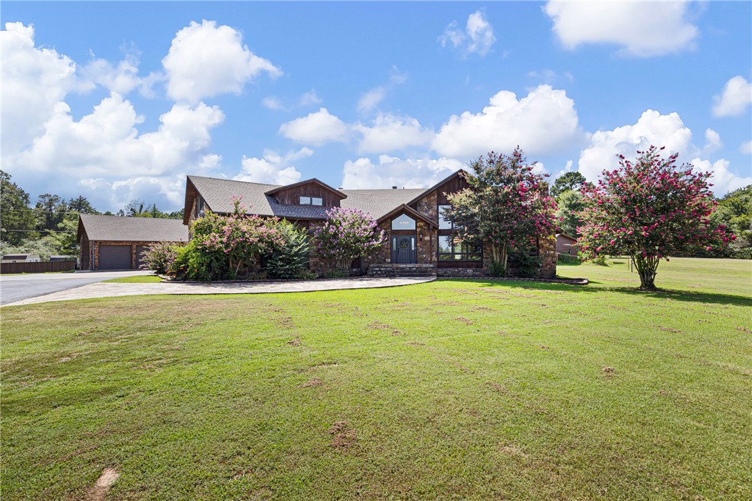 Impressive Custom-Built Estate on 20 Acres with private pond, pool, and dog breeding kennel! Wishing you could escape to your own private paradise? This breathtaking 5-bedroom, 4-bath custom home nestled on 20 pristine acres of countryside is your chance to do just that! Crafted from rich wood siding and rock, this one-of-a-kind residence offers timeless charm, luxurious comfort, and space to live, work, and play. Located in a quiet rural setting, yet close to modern conveniences. Two Fireplaces offer cozy living spaces. In-Ground Swimming Pool provides your summer oasis! Large private pond and 3-Car Detached Garage with plenty of room for toys and tools! There's also a 3,840Sq Ft Metal Building professionally outfitted as a top-tier dog breeding kennel with all the amenities! Room to roam, garden, ride, and enjoy nature in every direction...Pella windows and new roof 2023. Red iron steel kennel