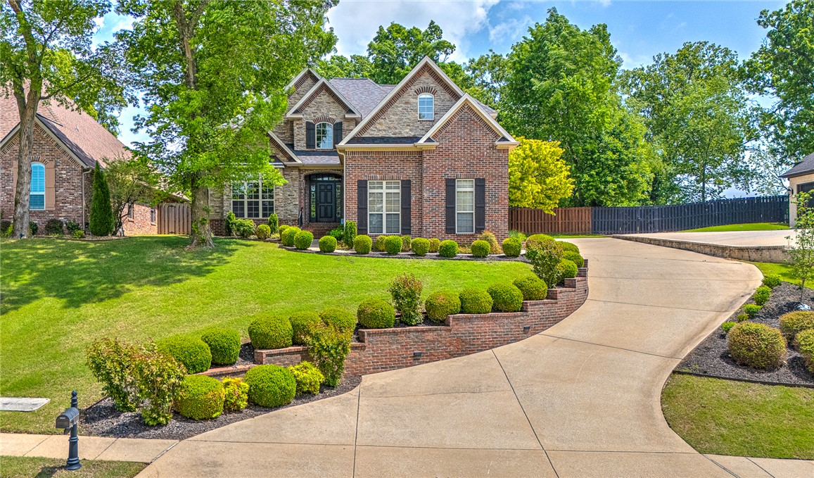 Desirable Shadow Valley Gated Golf and Tennis Community. Exquisitely remodeled from top to bottom, this stunning home showcases thoughtful, high-end updates throughout, including a fully renovated kitchen and baths, new flooring, fresh paint, and refined designer finishes. Elegant hardwood floors, designer quartz countertops, and plush new carpet upstairs create a warm yet sophisticated feel.  The chef’s kitchen features premium Frigidaire Professional Series appliances, including a double oven. Conveniences include a main-floor primary bedroom, an abundance of storage, and an oversized bonus room (optional 5th BR). Enjoy peaceful privacy with the backyard backing to mature trees, a covered patio and established landscape, while a flat driveway provides easy access to the garage. Major system updates add peace of mind, including HVAC and NEW Roof. A rare opportunity to own a beautifully updated, move-in-ready home combining style, space, and modern convenience.