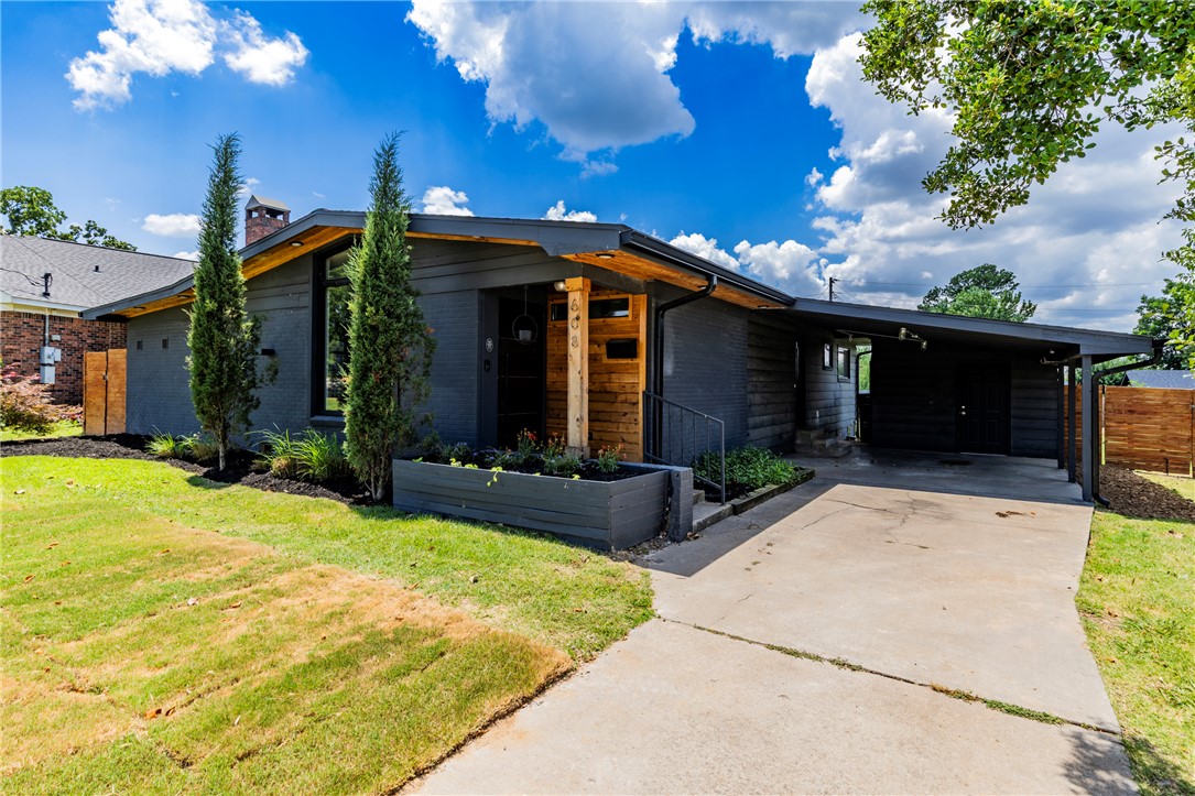 This is a certified unicorn. Right in the heart of Rogers, just 1.3 miles from Downtown Rogers, and only 4 miles to I49. This one has been fully renovated inside and out. Large concrete island, granite counters, Thermador double ovens, 48" Forno stove top, built in microwave and it all looks like it's out of a magazine. You'll love all the natural light!  New Pella windows, bathrooms, spray foamed insulation, electrical and plumbing redone in 2020.  Roof replaced in 2024. Awesome flat backyard to enjoy.  If you're seeking one that will not be duplicated and in this location, check it out.