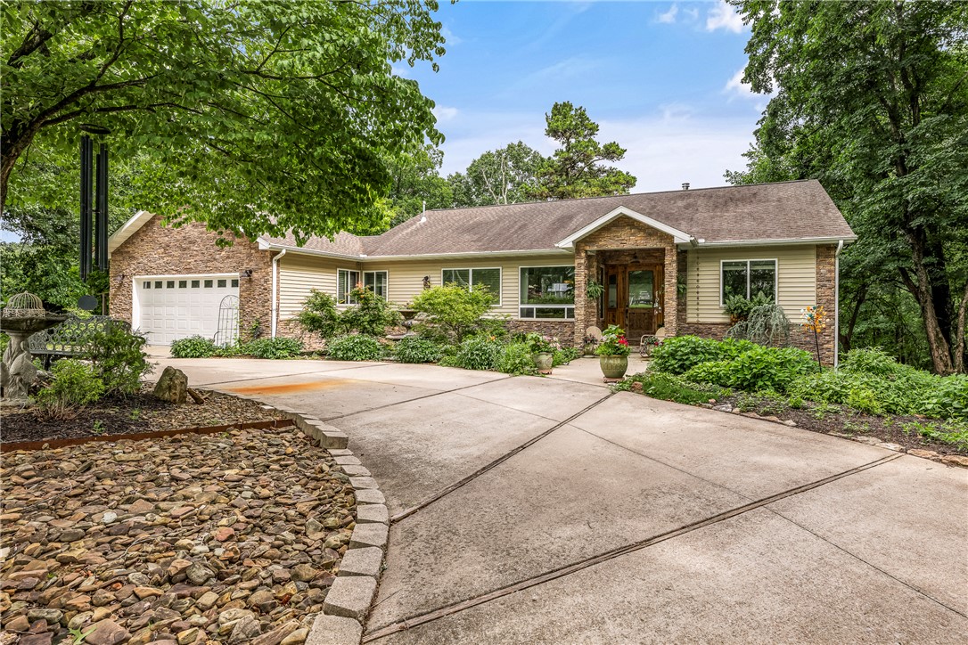 HOME WITH SMALL ACREAGE, close to everything downtown Rogers has to offer. This home will sell itself when shown. Very open floor-plan with tall ceilings thru-out. Separate workshop 21-20 and fenced in area for the dogs. Ride your bike or walk on the trail at Pleasant Ridge and go all the way around Lake Atalanta. Close to all the entertainment at the Railyard. Just a few blocks to the Bike Park. This home is very secluded but location, location to everything in NW Arkansas.
