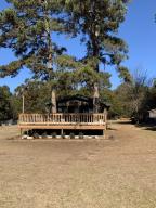 Privacy is yours in this farmhouse that features open living/kitchen area, 3 bedrooms 2 bathrooms and a sunroom.  Chicken coop, 40X60 shop with 12x12 doors with  drive  thru each end.  This home is totally secluded  and has a beautiful pond. Bring the animals