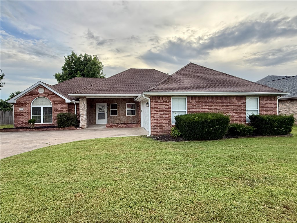 Enjoy the convenience of this beautifully maintained 3-bedroom, 2.5-bath home located in a desirable neighborhood with easy access to the Walmart campus, I-49, and NWACC. Situated on a spacious corner lot, this home features an inviting open-concept floor plan that's perfect for everyday living and entertaining.
The well-appointed kitchen offers a large island, glass cooktop, wall oven, and an impressive walk-in pantry with abundant storage. A spacious utility room includes a coat closet and convenient half bath.
Solid surface flooring runs throughout the home, providing easy maintenance, while all bedrooms feature ceiling fans and faux wood blinds for added comfort and style. The enclosed sunroom creates the perfect bonus space for a home office, playroom, or relaxing retreat. An additional storage room in the garage provides even more space for organization.
The owner maintains the yard, making outdoor upkeep worry-free. Owner will manage the property with an approved application.