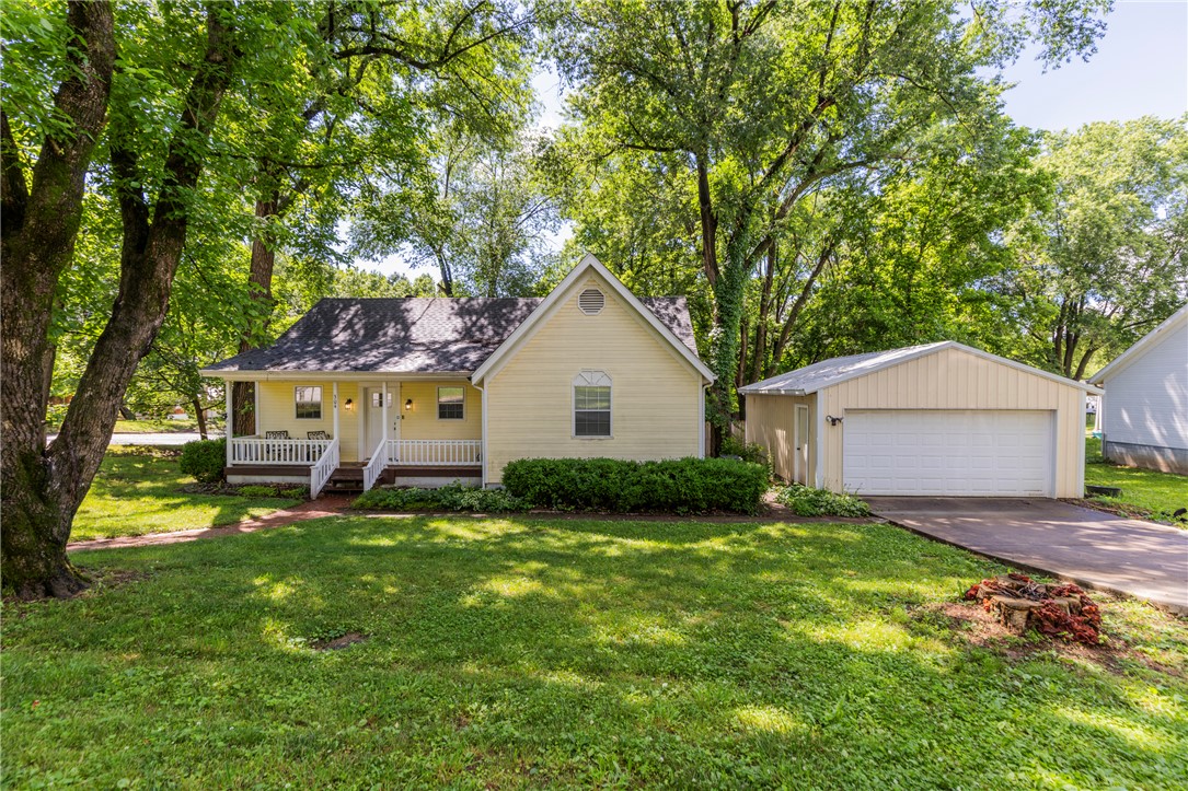Undeniable curb appeal, that's what you'll see as you walk up the brick walkway to  a covered front porch where the mature trees welcome you home. A cozy layout with character throughout. Out back, the swim spa with deck is perfect for year-round relaxation. The detached garage offers the kind of utility that can't be overstated. All of this on a quiet street where neighbors wave and kids still play outside. This home at 304 Phillips is cute, conveniently located and feature packed.