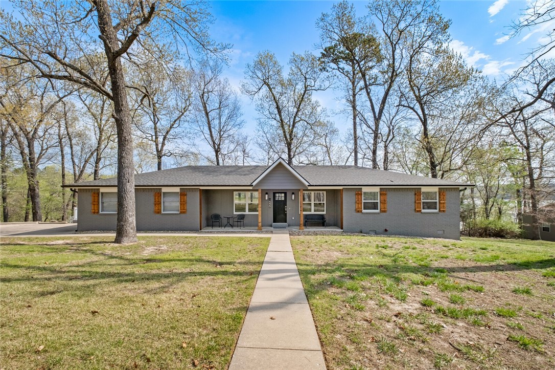 The perfect Beaver Lake getaway! 4 SLIP BOAT DOCK (2-10x26 and 2-10x12), COMPLETELY REMODELED, 4bdrm, 3 bath home nestled in Beaver Shores w/ gorgeous views overlooking the quiet cove from the wall-to-wall windows along the back of the house. Designed to entertain, the kitchen, dining & living room are all open to one another & steps away from the oversized upper & lower deck w/ fire pit, built for taking in all the lake life has to offer! Large game room/bonus room downstairs make this the ultimate home for all of your Beaver Lake fun! 24x36 shop w/ heaters & fans, new roof, new HVAC & whole house/shop generator hookup.