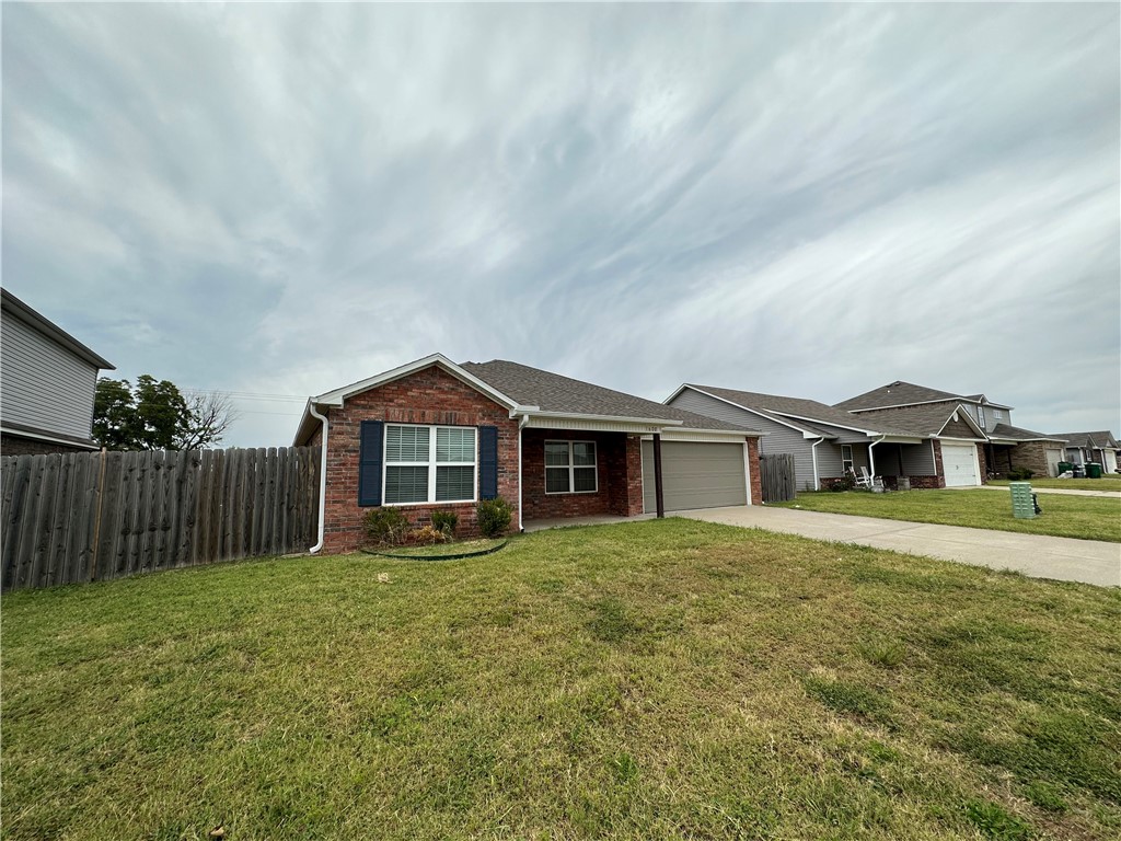 Delightful home in the Morningside Estates subdivision with new interior paint and carpet! This adorable 4 bedroom, 2 bathroom home offers functionality with an open floorplan producing cozy living space for the family. Lovely eat-in kitchen is equipped with wrap around bar with bar seating availability and pantry. Split bedroom layout. Wonderful backyard is fully fenced with patio area creating the space for you to relax and watch the children play. Close to everything you need including parks, schools with easy access to 71-B and I-49. Less than 15 minutes away from XNA, Downtown Bentonville, and Walmart Home Office. Must see this one today!
