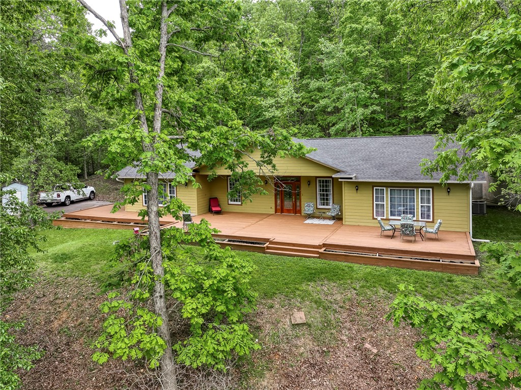Perched above the valley with a view that doesn’t get old, this home starts strong with a brand-new kitchen and a front deck made for slow mornings and laid-back evenings. Step inside to a wide-open flex space—currently home to a pool table—that’s ready for whatever fits your lifestyle. New HVAC and roof in 2022 take care of the big stuff, and the tankless water heater, water softener, chlorinator, and reverse osmosis system add everyday comfort. Out back, there’s a concrete pad in front ready for your future garage or shop. Come take in the view and see how easy it is to feel at home here.