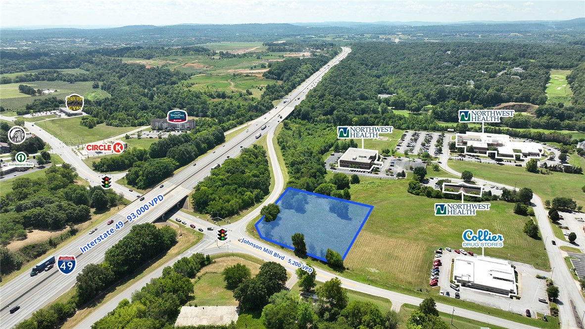 Prominent hard corner lot for sale with a traffic light, offering high visibility and accessibility to Interstate 49. Located just minutes from Johnson Square, Fayetteville’s business and shopping district, and Springdale’s thriving Care Corridor. Ideal for a convenience store, fuel station, office space, or retail use in a high-growth area. The city of Johnson is positioned in the heart of a rapidly growing area of Washington County and is a great investment opportunity.
Property Amenities
• +/- 1.54 acres
• Highly visible from Interstate 49
• Located on a hard corner with traffic light
• Zoned “Towncenter”