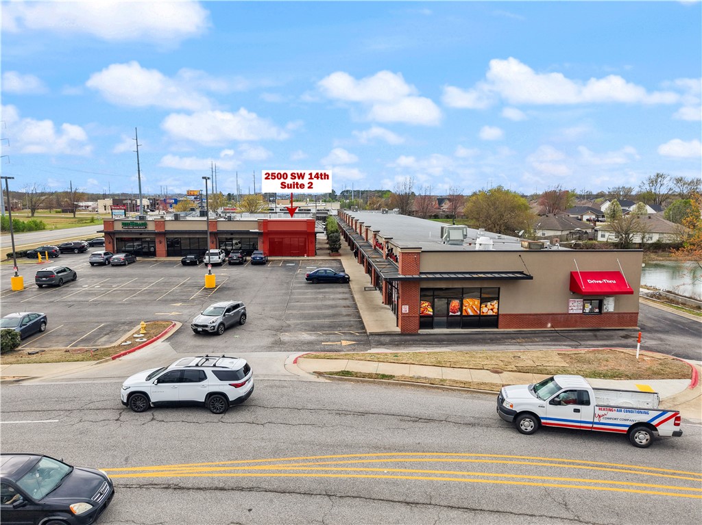 Excellent opportunity to lease a +/- 938 SF retail or office suite in the highly visible Milestone Plaza. Previously occupied by a skin care clinic, this functional space is well suited for medical, wellness, beauty, office, or professional service users. The layout includes a spacious reception and waiting area, two treatment or private office rooms with built-in counters and cabinetry, a restroom, and a laundry/storage room, providing a move-in ready setup for a variety of businesses. Positioned as a corner suite next to Beef O' Brady's, the property offers outstanding visibility and convenient access. Located along the "going home" side of SW 14th St with approx. 35,000 VPD, Milestone Plaza provides excellent exposure and is surrounded by established businesses in one of Bentonville's busiest commercial corridors.