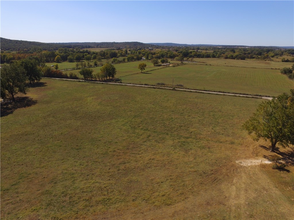 Five acre lot in Prairie Grove. Perc test has been done, but will require a septic plan prior to building. Water tap has been approved by Washington Water Authority. No gas. Minimum of 2500 sq ft house. Can not be used as a short term or long term rental property.