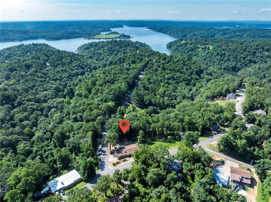 Welcome to the lake area community of Beaver Shores. Charming 1-story, home has been thoughtfully updated throughout. Kitchen has new cabinets and stainless appliances, bathrooms are updated with new cabinets and sinks. Covered back deck creates a perfect spot to enjoy your morning coffee, evening sunsets, or simply relax. Oversized, insulated garage is approx. 23.6 x 23.6, offering space for vehicles, lake toys, tools, or additional storage. Hosting guests, storing/recharging recreational equipment is easy w/a dedicated 50/120 Amp hookup in place. If it's boating, fishing, or simply spending time outdoors, this location puts you close to it all. 2 public boat ramps, and minutes from Hwy 12 boat ramp, and PC Marina.  Laundry hookup in primary bedroom, for added convenience, there is a second hookup in the garage.  If you’ve been searching for an easy-maintenance home and convenience to town, this home truly captures it. Roof & gutters are 2 years old.