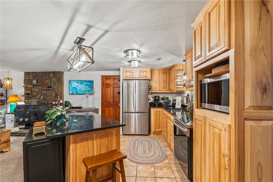 Welcome to the lake area community of Beaver Shores. Charming 1-story, home has been thoughtfully updated throughout. Kitchen has new cabinets and stainless appliances, bathrooms are updated with new cabinets and sinks. Covered back deck creates a perfect spot to enjoy your morning coffee, evening sunsets, or simply relax. Oversized, insulated garage is approx. 23.6 x 23.6, offering space for vehicles, lake toys, tools, or additional storage. Hosting guests, storing/recharging recreational equipment is easy w/a dedicated 50/120 Amp hookup in place. If it's boating, fishing, or simply spending time outdoors, this location puts you close to it all. 2 public boat ramps, and minutes from Hwy 12 boat ramp, and PC Marina.  Laundry hookup in primary bedroom, for added convenience, there is a second hookup in the garage.  If you’ve been searching for an easy-maintenance home and convenience to town, this home truly captures it. Roof & gutters are 2 years old.