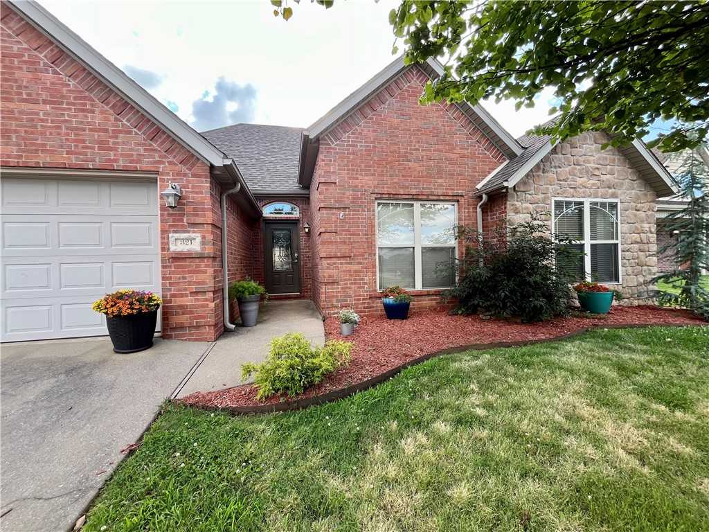 Beautifully maintained 3BR/2BA all-brick home in a quiet neighborhood just 10 minutes from the Bentonville Square and 5 minutes from Coler Creek trails. Offering just over 2,200 SF with 9-foot ceilings throughout, this home feels spacious, bright, and inviting. Enjoy all hard-surface flooring and a well-appointed kitchen featuring KitchenAid appliances, including a gas range. Large windows fill the home with natural light, while the sunlit dining area opens to a patio and fully fenced backyard. The oversized primary suite offers space for a sitting area or home office and includes private patio access. Generously sized bedrooms, functional living spaces, and a prime location near trails, dining, shopping, and entertainment make this move-in-ready home an exceptional opportunity.