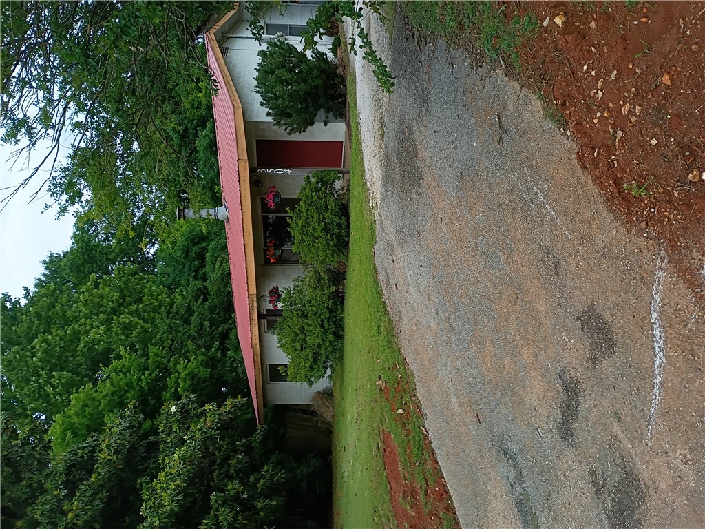 Opportunity is knocking with this 1+ acre-sized lot and 1300+ home, offering highway frontage. Located across from Mt. Comfort Square and just minutes away from the University of Arkansas, downtown Fayetteville, trails, shopping, dining and nearby elementary and preschool options. This site offers endless potential, don't miss your chance to own this desirable property.