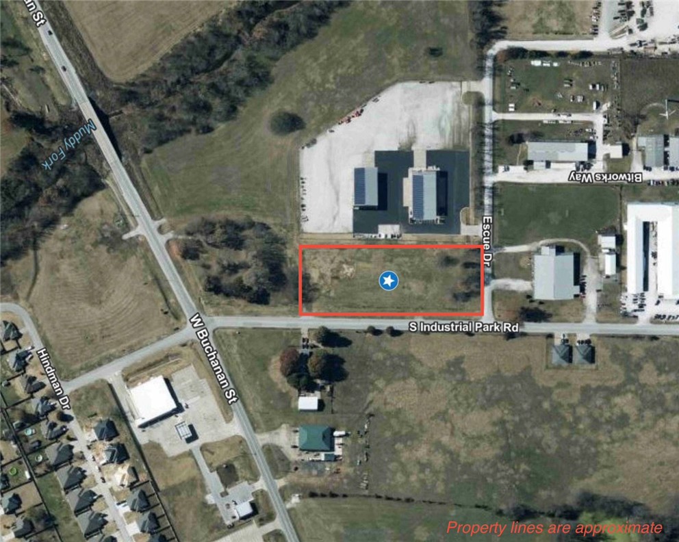 Exceptional opportunity to own approximately 3.41 acres at the corner of Escue Drive and S. Industrial Road in the growing community of Prairie Grove. Currently being surveyed and split from the parent tract, this property will receive a new legal description and parcel number prior to closing. Zoned M-2 (Industrial) and MU-B2 (Mixed Use Business 2), it offers excellent potential for a variety of commercial, industrial, and mixed-use uses, subject to city approval. High-visibility corner location with excellent access and outstanding potential in one of Northwest Arkansas' growing commercial corridors.