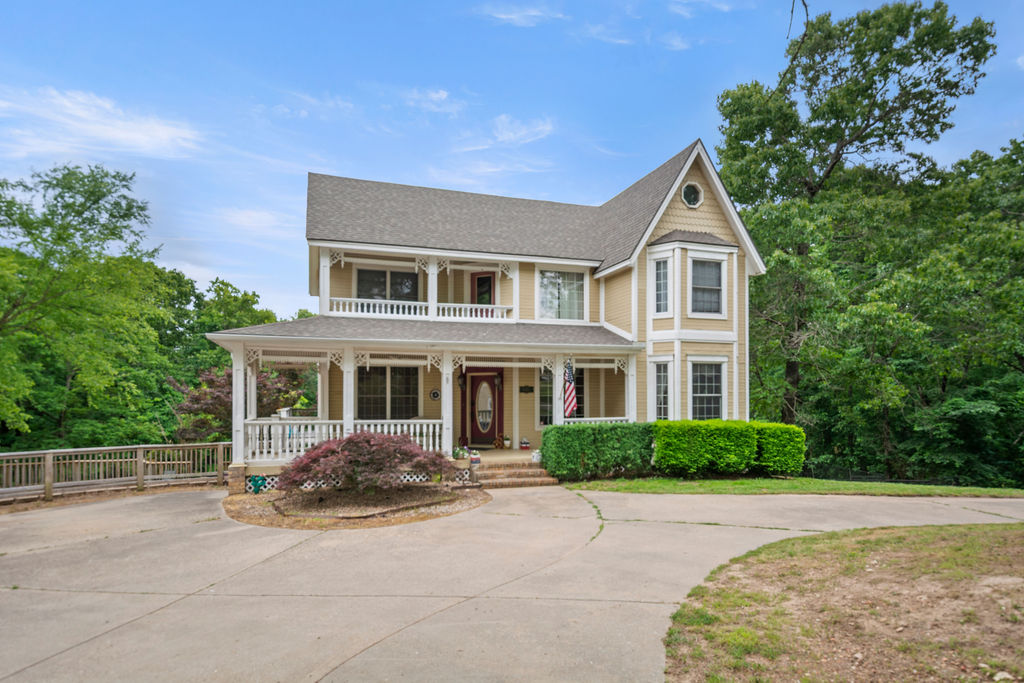 Welcome Home! This stunning 4,350 sq ft Victorian home blends timeless charm w/modern comfort showcasing classic architectural details, beautiful woodwork, & lots of windows. The main level offers a spacious kitchen, formal dining, large LR, & a library. Head up the grand staircase & find the huge master suite that feels like a peaceful retreat w/a spa-like bath & private deck overlooking the pool. Two more beds, laundry, & private balcony finish out the upstairs. Head down to the finished basement & find another large LR (could be a 2nd master suite), 1.5 baths, exercise space, & lots of storage. Outside, enjoy your 8' deep salt water pool (pump motor rebuilt 2025 & new salt water sand filter system 2024), mature trees, & large fenced in yard. The detached 2 car garage has a large game room (used to be a Barber Shop) w/half bath & a huge loft upstairs. Income Generating billboard out front & this property is not inside the POA, so no POA dues. With some updates & repairs, this home will be the talk of the town!