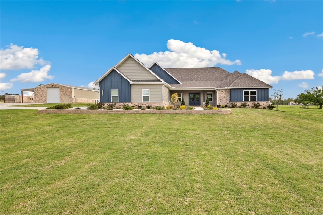 Stunning 1YO custom home featuring 4BR/3BA - 2,930 SF, situated on 10.68 AC m/l of gorgeous countryside. This beautifully designed property offers high-end amenities throughout, incl top-of-the-line appliances, premium fixtures, & upscale flooring to showcase exceptional quality & style. The spacious floor plan is complemented by a large laundry area & a 3-car garage. Step outside to a beautifully landscaped yard w/a full sprinkler system, creating a lush, outdoor setting. Sturdy pipe-fenced pastures w/cross fencing provide excellent functionality for livestock, horses, or rotational grazing. You'll also find an impressive 36x80 insulated shop/barn w/concrete floors & infrared heat. Equestrian enthusiasts will love the two gorgeous horse barns complete w/2-stalls, a tankless HWH & a wash area, making this property ideal for horses. A rare opportunity to own a nearly new home w/luxury features, functional outbuildings, & breathtaking acreage. This is truly a must-see property to fully appreciate all it has to offer!