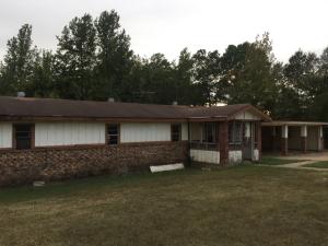 BANK REPO If this is what you're looking for, we got it! House sits neatly along Hwy 64, but is in need of major renovation. Investor special; enter at your own risk!