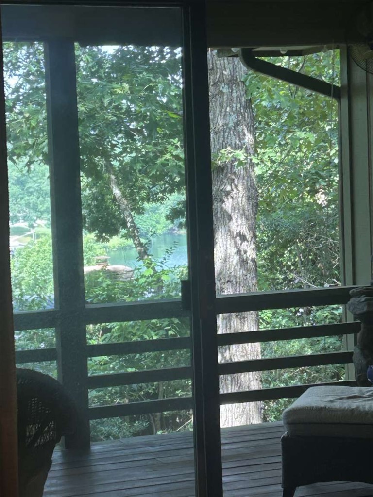 Beautiful year-round lake view (so much better in person!) lake access 300 yds; stunning sunsets over the lake from spacious, covered back deck. Fully wooded in front, with no shortage of deer. Short walk on trail to Tanyard Creek and waterfall. Quiet and private. Large living room leads out to back deck. Spacious kitchen with bar, beautiful wood cabinetry with slide outs; Dining area overlooks the woods in front. Large master bedroom with bath and seasonal lake view. Spring and summer feel just like living in a treehouse! Second bedroom also has wooded view. Soft, luxurious, high-quality nylon carpet throughout. Extremely energy-efficient heat pump-2019. Natural stone fireplace with forced-air heating option. Smart thermostat—adjust temperature from your bed (or anywhere.) Super clean under-house storage. Oversized two-car garage with workshop area. New roof 2020. Small wire fencing in back optional. This home is rich in character, built with quality and integrity.