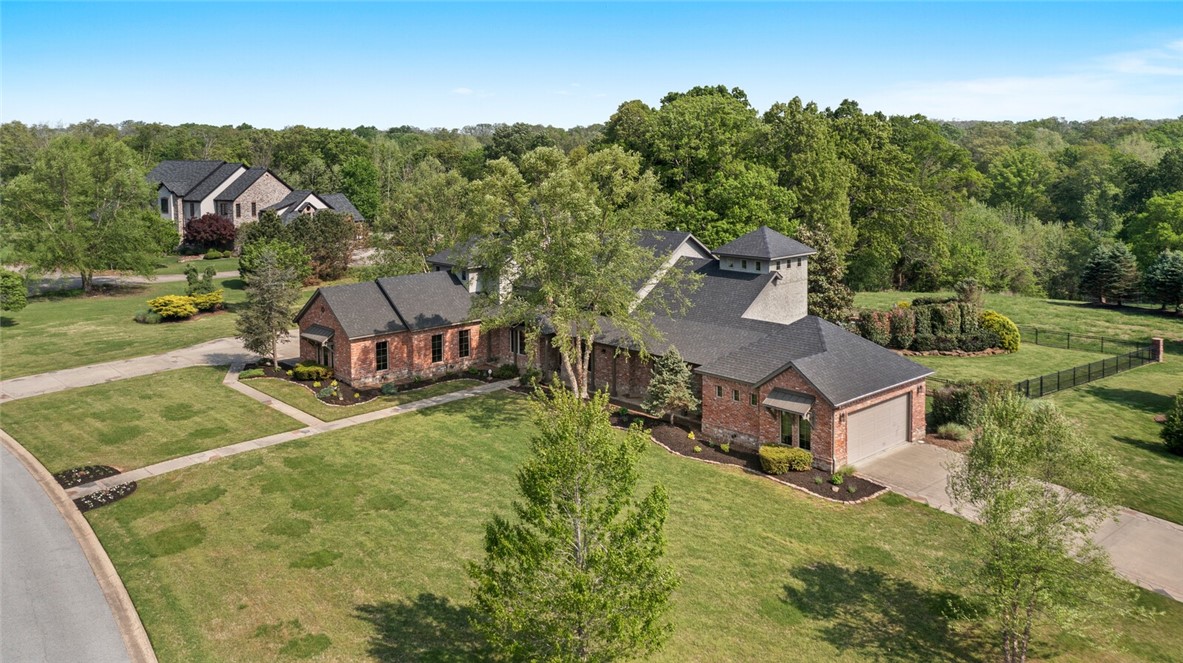 From the moment that you arrive at this Talamore property, you will be drawn in to the spectacular 3.09 acre property and taken with this brilliant architecturally designed home. The main level has a spacious open floor plan with high ceilings, great natural light, 2 bedroom en-suites, private study, open dining rm & vaulted coffered ceiling great rm with floor-to-ceiling limestone fireplace. The gourmet kitchen features exquisite millwork, marble countertops, hidden walk in pantry & high end stainless steel appliances. The primary suite offers patio access, sitting area and stunning master bath with separate vanities, 2 walk-in closets & custom shower and sunken bath. The fully equipped theater room features stadium seating, custom wet bar w/lit bar top and surround sound system. This estate boasts incredible living spaces inside & outside. The expansive covered veranda has a wonderful outdoor fireplace and built in grilling station- all overlooking the resort-style gunite pool w/tanning shelf, and pool fountains.