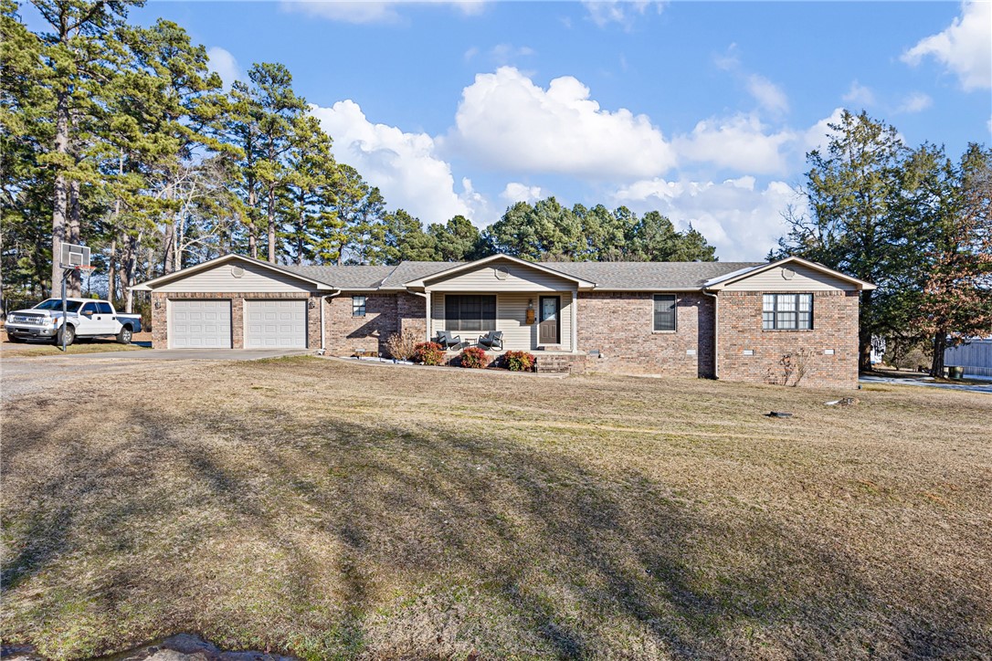 Welcome home to this beautifully maintained 3-bedroom, 2-bath property situated on a full acre. Recently updated, the home features custom cabinetry and granite countertops with an open, functional layout. The living room offers a cozy electric fireplace, perfect for relaxing evenings.
The spacious master bedroom is complete with large soaking tub, separate shower, and a walk-in closet. Two additional bedrooms provide comfortable space for family, guests, or a home office.
Outside, you’ll find a partially privacy fenced backyard ideal for pets, along with a patio for outdoor entertaining. The home has landscaping that enhances the front entry. The large shop offers a large overhead garage door and upper level for storage area. A standout feature in large shop, is the small living quarters on the front side. The shops living area includes an open-concept design with a Murphy bed, bathroom, and kitchenette —perfect for guests, hobbies, or extra flexibility.