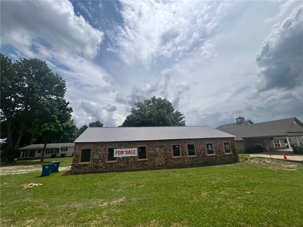 nvestment opportunity in the heart of rapidly growing Gravette! Located at 1002 1st Ave SE, this 0.69 +/- acre property offers approximately 155 feet of highly visible Highway 59 frontage with outstanding exposure and future potential. Currently zoned residential, this property presents an excellent opportunity for possible commercial use development with high traffic visibility and a prime location directly across from the revenue office and Subway.



The existing home will require major repairs, making this an ideal option for investors, developers, or entrepreneurs looking to capitalize on the location and frontage. A shop building on the property already features newer roof and windows. Whether you are looking for a redevelopment opportunity, future business location, or investment property, this tract offers incredible potential in one of Gravette’s busiest corridors