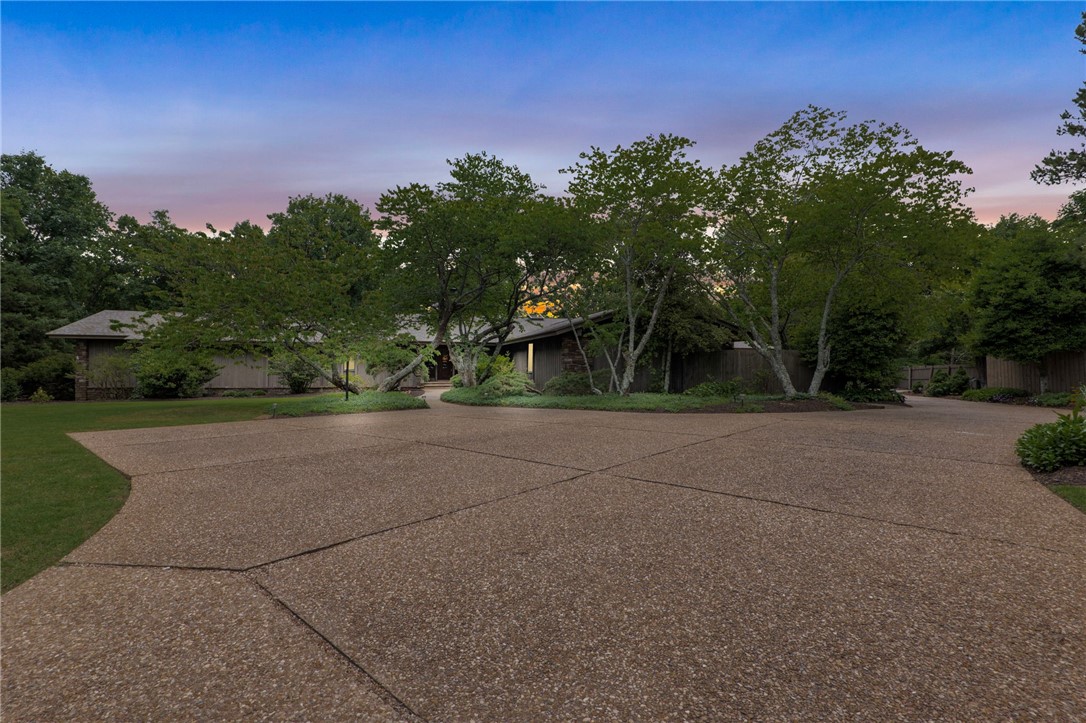 This stunning one-owner home sits on an expansive 2.53-acre, offering plenty of space and privacy. Designed by renowned architect Albert Green, this mid-century modern gem boasts 4 bedrooms, 3.5 bathrooms, including a 2nd primary bedroom.As you enter the home, you'll be greeted by an open floor plan that's filled with natural light. The main living area features soaring ceilings, floor to ceiling windows, rock fireplace, sleek lines, and a minimalist aesthetic that's both stylish and functional.The primary suite is a true oasis, complete with a spa-like bathroom, which also features a sauna. Outside, the property is equally impressive, with lush landscaping, mature trees, and a large deck area. And when you're ready to cool off, you can simply walk across the street to the neighborhood pool and tennis court. Extra room in the garage for storage/workshop.This is the first time this home has ever been on the market, so don't miss your chance to own a piece of architectural history in a highly sought-after location.