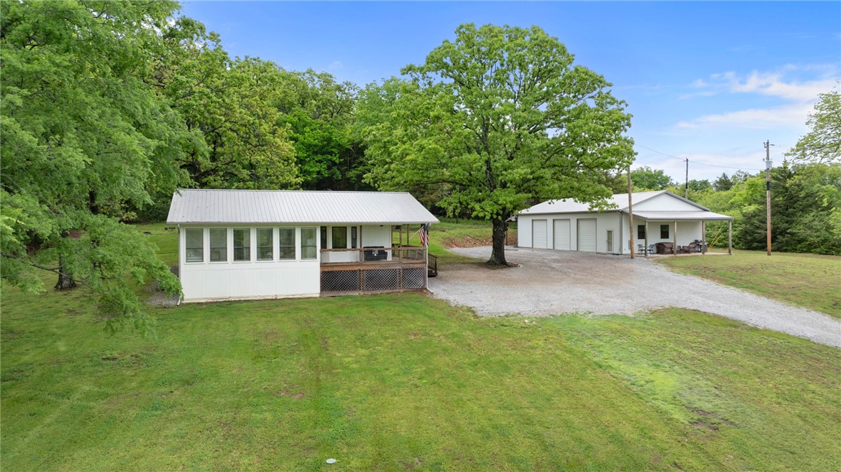 Fully renovated 2 BR, 2.5 BA home with shop, guest ADU on 6.27 acres! The main house is 1332 SF & ADU is 501 SF for a total of 1883 SF of living space. Awesome views to the south from the spacious covered porch! Beautifully remodeled! 2x6 exterior construction. Open floor plan. Kitchen with marble countertops & stainless steel appliances.  Large pantry. New windows throughout much of the house.  Nice LVP flooring. 1/2 bath added at the end of the laundry room for guests. Both bedrooms have ensuite baths & walk-in closets. Sunroom with south-facing windows. 30x60 shop, built in 2022, has a large office/storage room, fully insulated, mini-split heat & air. The ADU is in part of the shop bldg with a covered patio, 1 large bedroom, 1 bath & kitchenette/living room space with its own mini-split system. Perfect for extended family, guests, or for extra income as an Airbnb. The land also fronts on Trammel Mtn Rd, making it ideal to split in the future for another home site. Nice dog run. Truly a great place to call home!