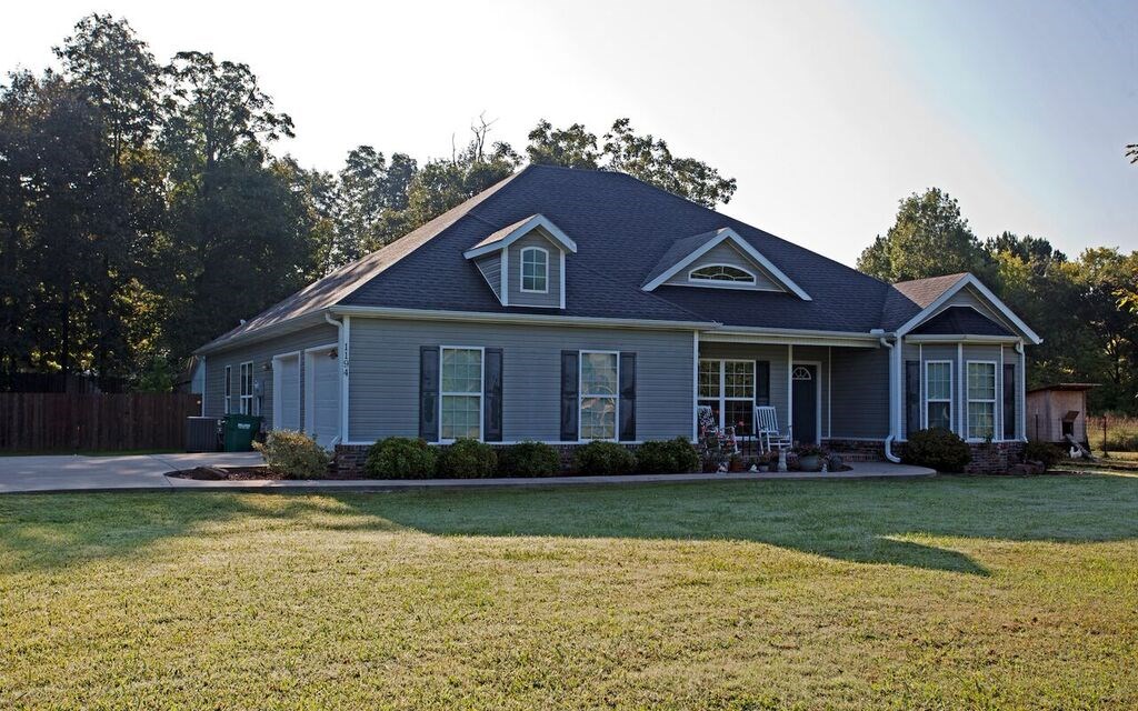 Beautiful 4 bedroom, 2 bathroom, one owner home on 1.17 acres in Rockcreek S/D. Features inviting neutral colors, large kitchen w/granite counter tops & pantry, formal dining room w/cathedral ceilings, spacious living room w/12’ ceilings & wood burning fire place and master suite w/his and her walk-in closets, walk-in shower & his and her sinks. Nice covered patio, gorgeous fenced in yard, 10x20 storage shed and 2 peach & 2 apple trees. Great location 10 mins from Fayetteville & just outside Greenland.
