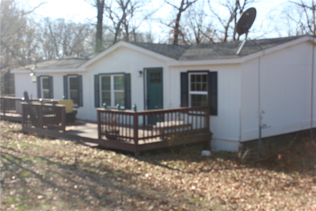 Take a look at this recently remodeled 3 bed 2 bath Doublewide on a permanent foundation sitting on 7.07 acres of woods. Watch the deer off your back deck. Beaver lake and Indian creek campground are minutes away.