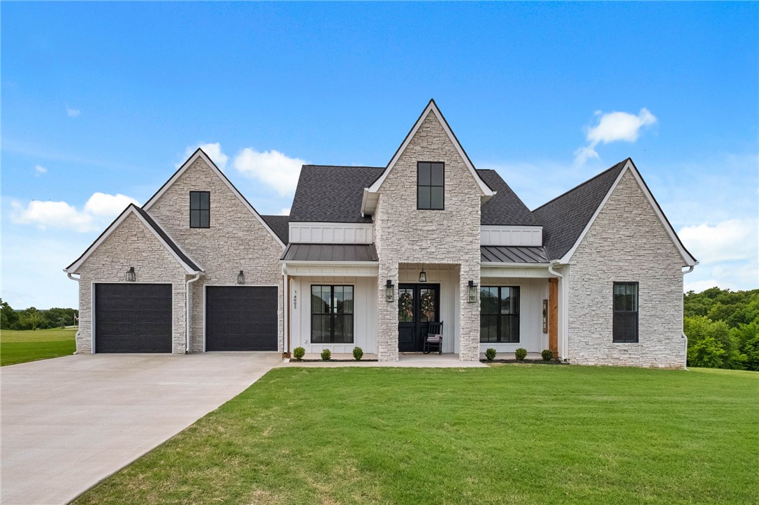This stunning home offering the perfect blend of modern luxury and timeless design. Situated on 1 acre, this 4 bedroom, 3.5 bathroom home features an open floor plan with soaring ceilings, abundant natural light, and upscale finishes throughout. The spacious living area flows seamlessly into the chef’s kitchen complete with large island, gas cooktop with pot filler, Frigidaire appliances, quartz backsplash and walk-in pantry. The primary suite offers a relaxing retreat with a spa-like bath featuring his/hers vanities, spacious dual-head shower with rain-head, soaking tub and large walk-in closet. Additionally, one of the 3 guest bedrooms features an en-suite bath and walk-in closet making this home comfortable/functional for families of all sizes. Enjoy peaceful surroundings and views from the covered outdoor living area that you have access to from your primary suite and living room. This is a rare opportunity to own a beautiful home on a spacious lot while still being conveniently located near town and amenities.