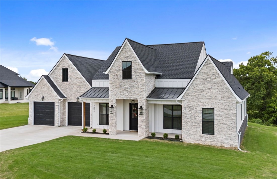 This stunning home offering the perfect blend of modern luxury and timeless design. Situated on 1 acre, this 4 bedroom, 3.5 bathroom home features an open floor plan with soaring ceilings, abundant natural light, and upscale finishes throughout. The spacious living area flows seamlessly into the chef’s kitchen complete with large island, 8 burner gas cooktop with pot filler, Frigidaire appliances, quartz backsplash and walk-in pantry. The primary suite offers a relaxing retreat with a spa-like bath featuring his/hers vanities, spacious dual-head shower with rain-head, soaking tub and large walk-in closet. Additionally, one guest room features an en-suite bath and walk-in closet making this home comfortable/functional for families of all sizes. Enjoy peaceful surroundings and views from the covered outdoor living area that you have access to from your primary suite and living room. This is a rare opportunity to own a practically new home on a spacious lot while still being located 15 minutes away from XNA.