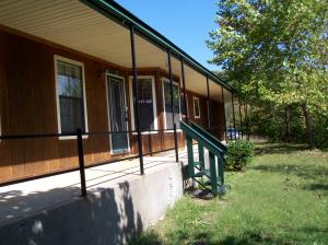 Check out this newer 3 BR, 2 BA, home on almost 8 Acres M/L with paved road. The home sits private above the Hwy with lots of trees. Nice walk-in closets and 2 car garage.