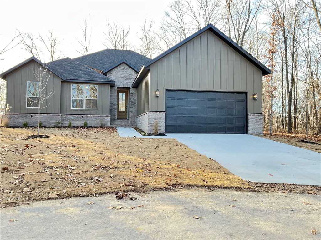 RARE FIND NEW CONSTRUCTION ON LEVEL LOT  10 minutes from DOWNTOWN BENTONVILLE This Bella Vista gem is one you won't want to miss!  Welcome to this charming  home nestled in the peaceful surroundings of Bella Vista Offering 2 bedrooms, 2 full baths and a versatile flex room, this property provides the perfect blend of comfort, functionality and Ozark charm.  Inside, you will find an inviting open concept living area abundant natural light, ideal for both relaxing and entertaining.  The kitchen features stainless appliances, Quartz Countertops , walk in pantry and a convenient layout that flows seamlessly into the dining and living areas.  The primary suite offers a private retreat with free standing bathtub, walk in shower and generous closet space.  The flex room is perfect as a home office, craft room or work out space.  Enjoy the outdoors from the patio surrounded by Bella Vista's wooded backdrop with only 4 homes in this small subdivision