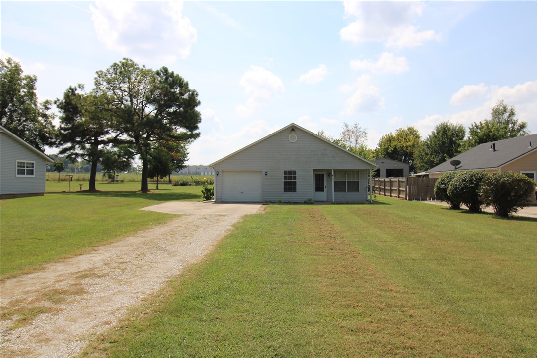 Welcome to this cozy Lowell home on .5 acres, conveniently located near JB Hunt and I-49. With 2 bedrooms, 1.5 bathrooms, and a spacious living room, this property blends comfort and convenience. Inside, you’ll enjoy brand-new LVP flooring in the main living areas, adding both style and durability. The layout provides a large, open living room, a functional kitchen, and comfortable bedrooms. For added convenience, a washer, dryer, and refrigerator are included—making move-in a breeze. Outside, the half-acre lot provides room to relax and enjoy, while the 1-car garage offers secure parking and storage.
