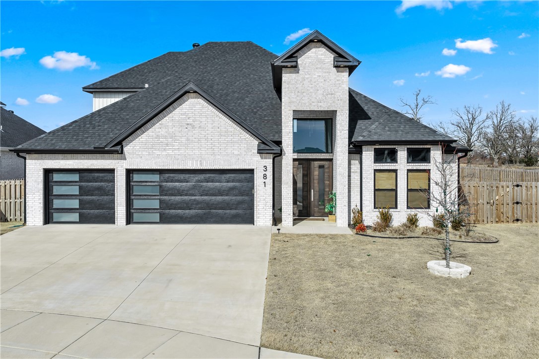 Welcome to Silver Leaf Estates, where luxury living meets effortless style. This breathtaking 2024 build at 381 Rainforest Loop is more than a home — it's the backdrop for your best life. Imagine mornings in a chef's kitchen dazzling with quartz, designer lighting, and upgraded appliances, evenings gathered around a soaring quartz fireplace, and weekends by the community pool. With 5 bedrooms, 3.5 baths, and 2,860 sq ft of impeccably upgraded space — black-on-black windows, custom doors, wide-plank floors, and spa-worthy baths — every detail was designed to impress. The striking whitewashed brick entry and grand dark wood door set the tone before you even step inside. A 3-car garage, covered patio, and wood privacy fence give you room to breathe, while trails, a clubhouse, and a dog park invite you to connect. Perfectly positioned near a brand-new super center and quiet cul-de-sac. Over $100K in upgrades. Zero compromises. Come see it before someone else calls it home.