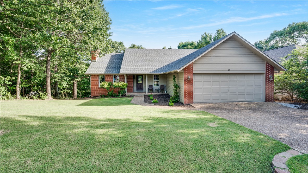 Back on Market at no fault of seller! Brand new roof with high-impact architectural shingles and new PEX plumbing installed in July. This beautifully updated wooded retreat features oversized living room,large wood-burning fireplace,durable wood-look ceramic plank flooring,crown molding & recessed lighting. Kitchen boasts white cabinetry, quartz countertops,ceiling fan,informal dining room w/bay windows.Formal dining room offers scenic outdoor views.Interior highlights include a leaded glass front door,upgraded wood-encased double-hung windows.Bonus room serves as perfect home office with closet.Primary suite has private fully tiled bathroom w/walk-in shower & quartz countertops.Step outside to an entertaining deck overlooking a flat, garden-ready backyard. Storage area with workbench underneath house. Large garage has insulated door and two walk-in closets with shelves. Location offers ultimate convenience,5 minutes from Walmart, Hwy 71, & Bella Vista Country Club and direct access to Bamboozled Trail. on Market!