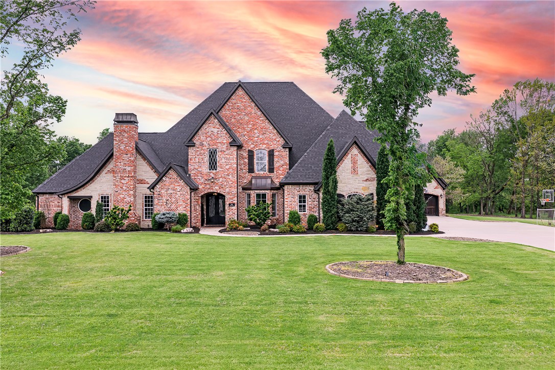 Tucked within the prestigious Copper Ridge neighborhood, this breathtaking 6-bedroom, 6,579 sq ft brick estate redefines NWA luxury living — just minutes from Walmart's Home Office and the world-class dining and culture of Downtown Bentonville. Sprawling across 3.55 private acres of open lawns and wooded tranquility, this 2019-built masterpiece features soaring cathedral ceilings, a gourmet kitchen with gas cooktop and double ovens, a glass enclosed beverage and wine cellar, 2 gas fireplaces, and a sophisticated wet bar made for unforgettable entertaining. A built-in storm shelter/safe room, discreetly accessible through the expansive Butler's pantry, offers true peace of mind. Unwind at your private in-ground pool, host movie nights in the media room, or recharge in the dedicated exercise suite. A whole-home generator, 4-car garage, central vacuum, wired sound system, and a brand-new 2024 roof deliver effortless, worry-free living. This isn't just a home — it's a legacy property for those who expect the very best.