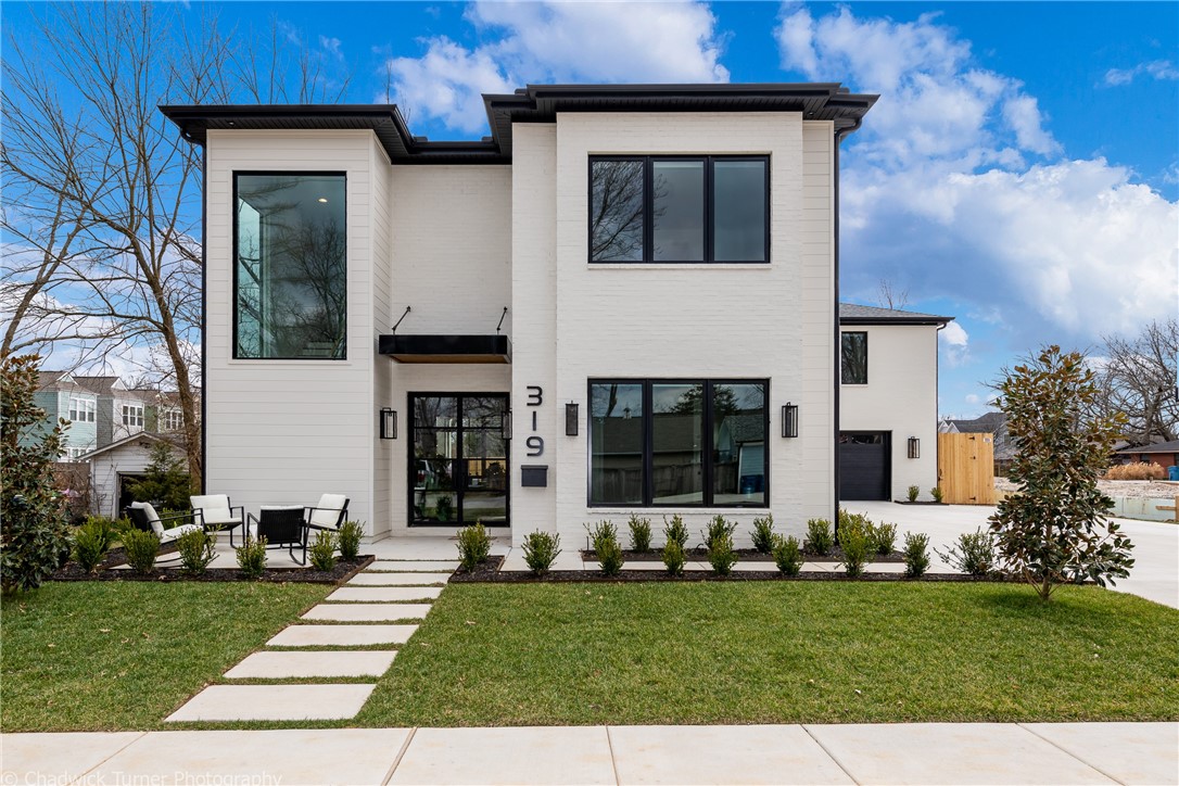 Incredibly well designed home in downtown Bentonville. The area is known for its art, food, culture, mountain biking trails and of course the home of Walmart. This home is located blocks form the square  on large lot with pool and garage apartment. This amazing home is open and bright with high end designer finishes. This was a custom home completed in the fall of 2020. The designer, architect, builder and owner closely collaborated to bring to life one of the most outstanding properties you will find in downtown Bentonville. No expense was spare from the quartzite kitchen counters to the dramatic stair case. The overall design is layered with textures including the wide plank hardwood floors, custom built-ins and amazing windows. The foyer is flanked by shoji doors that lead to the office and a powder room with floating cabinet and brass faucet jetting out of the mirror. The kitchen will amaze you and the owners suite is a true sanctuary. Pool has retractile cover. Don't miss the outdoor kitchen!