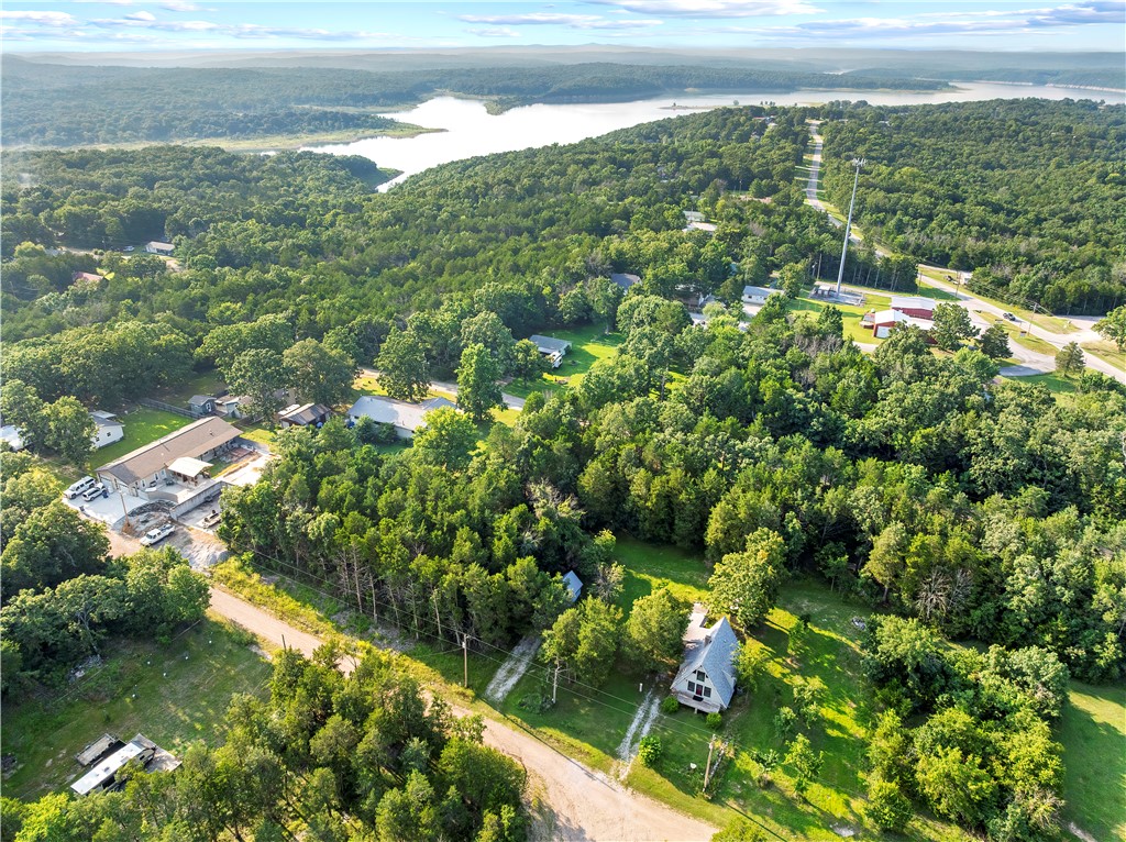 Nestled in the heart of Diamond City, this approximately 0.21± acre wooded lot offers the perfect opportunity to build your Ozarks getaway or full-time home just minutes from beautiful Bull Shoals Lake. Mature trees provide a peaceful, natural setting while public water and public sewer are available at the road, making future development even more convenient.

Enjoy the charm of small-town living with nearby lake access, marinas, fishing, boating, and endless outdoor recreation, all while remaining close to everyday amenities. Whether you're planning your forever home, a weekend retreat, or an investment property, this lot offers an excellent location in one of the area's most desirable lake communities.

Buyer to verify availability of utilities, lot dimensions, building requirements, and all other information through their own due diligence.