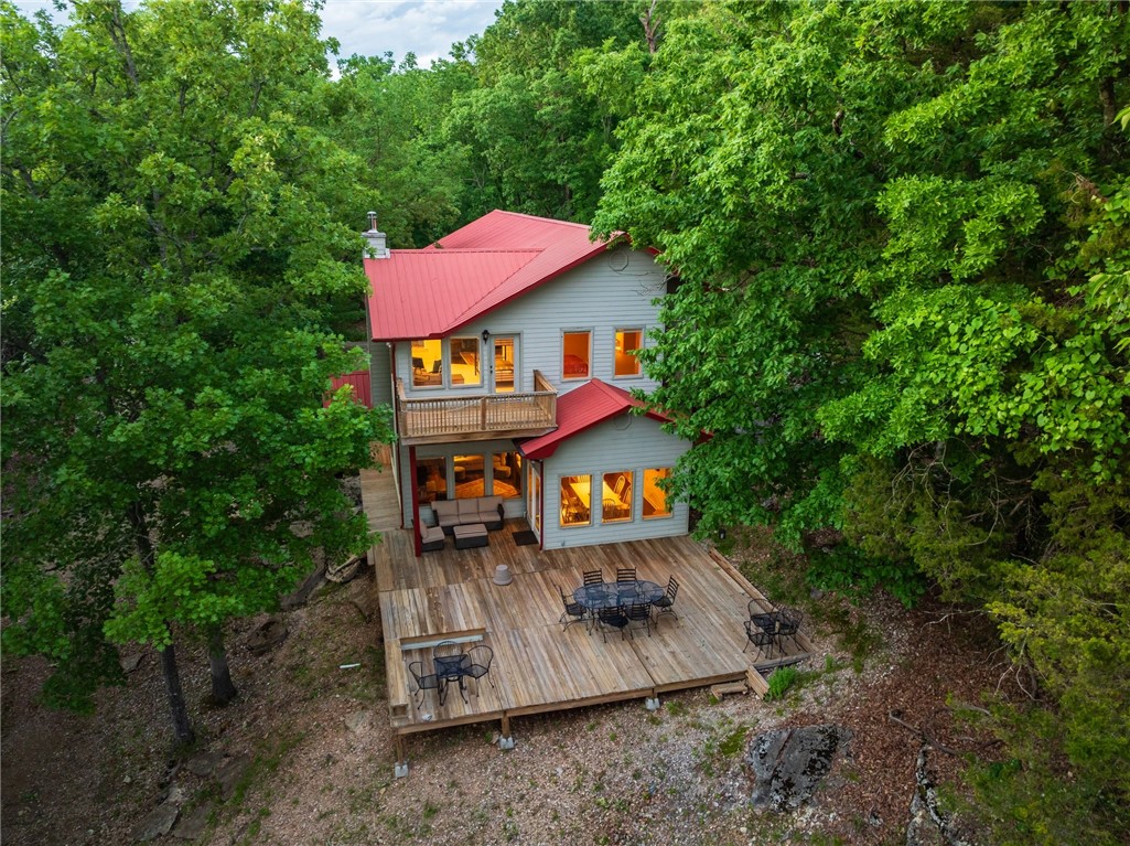 Discover your own slice of paradise on Beaver Lake. This stunning property spans 3,060 square feet and boasts three spacious bedrooms and 2.5 baths, perfectly designed for comfort and convenience. Enjoy the luxury of a generous second-floor flex space, complete with a 15’ x 13’ recreation area & a cozy 15’ x 12’ loft—ideal for an office or additional living space.

Recent upgrades elevate this home, including a new roof on the boat dock with a solar panel, new water lines, and enhanced insulation. The property features a two-slip private boat dock with easy access to lake activities. The slips measure 32’ x 10’ and 24’ x 10’, with the smaller slip equipped with a boat lift.

Revel in the beauty of nature with six acres of seclusion and incredible views from the generous windows throughout the home. Additional highlights include hardwood floors in the common areas, a walk-in pantry, and ample storage space in the garage and bedrooms. A 30x40 steel workshop offers even more room for hobbies, storage, or projects.